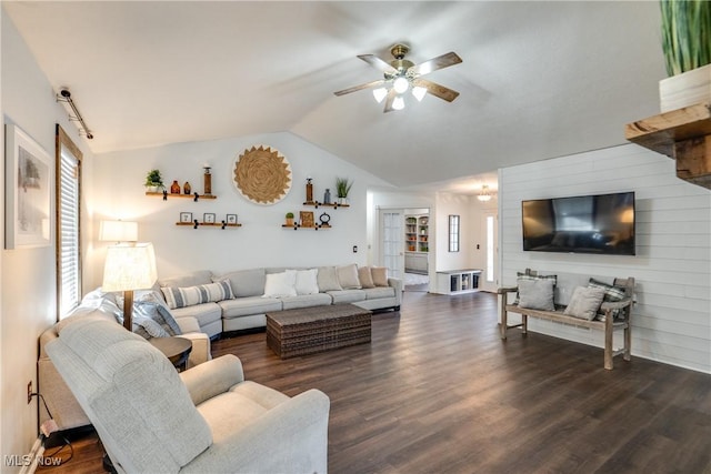 living room featuring vaulted ceiling, dark wood-style floors, a wealth of natural light, and ceiling fan