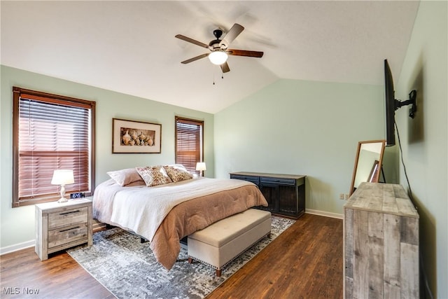 bedroom featuring ceiling fan, baseboards, lofted ceiling, and wood finished floors