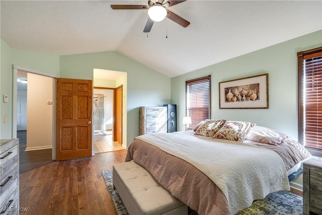 bedroom featuring baseboards, a ceiling fan, dark wood-type flooring, and lofted ceiling