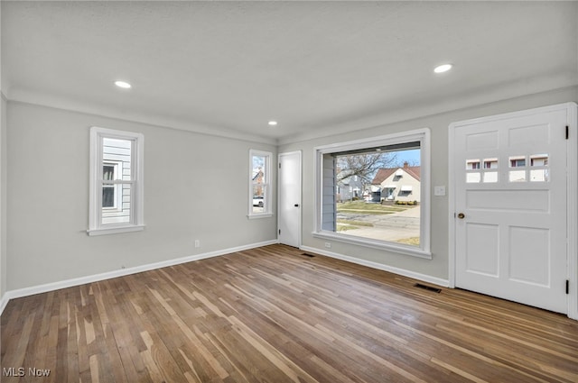 foyer entrance with visible vents, recessed lighting, baseboards, and hardwood / wood-style flooring