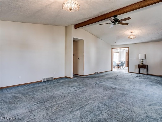 empty room featuring lofted ceiling with beams, visible vents, carpet floors, and a textured ceiling