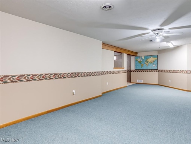 empty room featuring visible vents, baseboards, and a ceiling fan