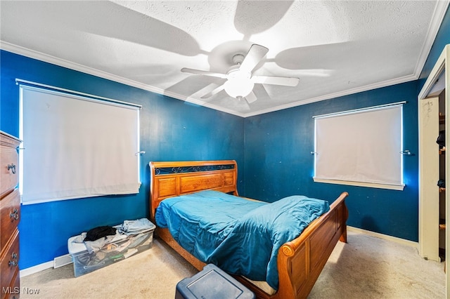 carpeted bedroom with ceiling fan, baseboards, a textured ceiling, and ornamental molding