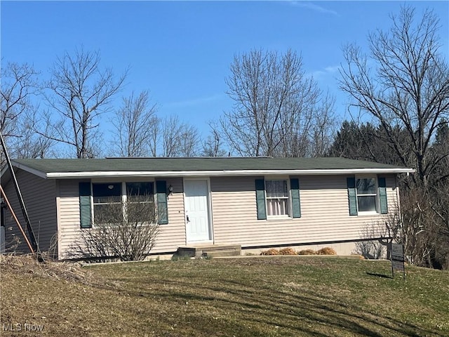 view of front of property with a front lawn