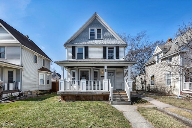 traditional style home featuring covered porch and a front lawn