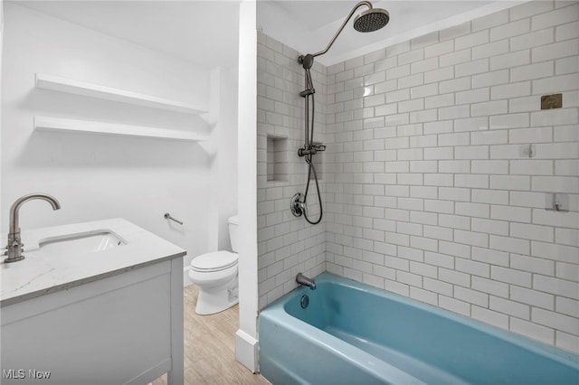 full bathroom featuring shower / washtub combination, toilet, vanity, and wood finished floors