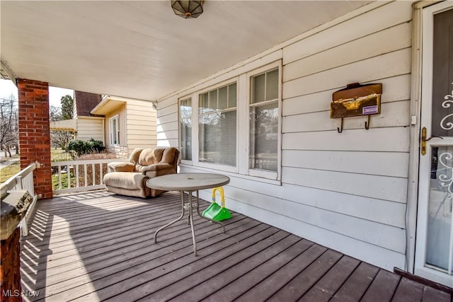 wooden deck featuring covered porch