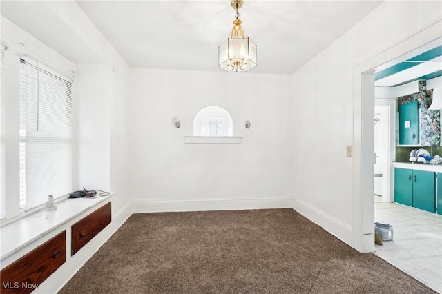 interior space with plenty of natural light, baseboards, and carpet floors