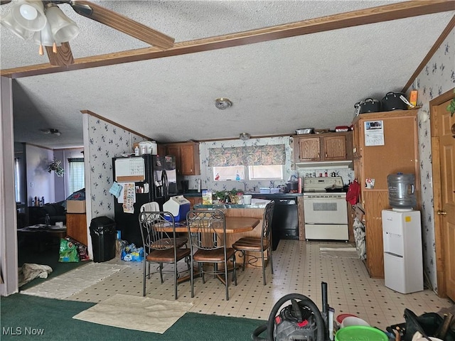 dining space featuring a ceiling fan, light floors, lofted ceiling, a textured ceiling, and crown molding