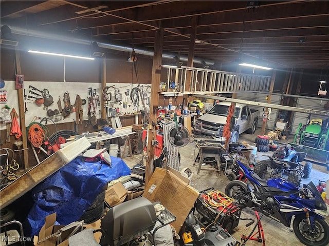 garage with a workshop area