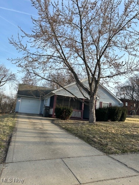 single story home with an attached garage and concrete driveway