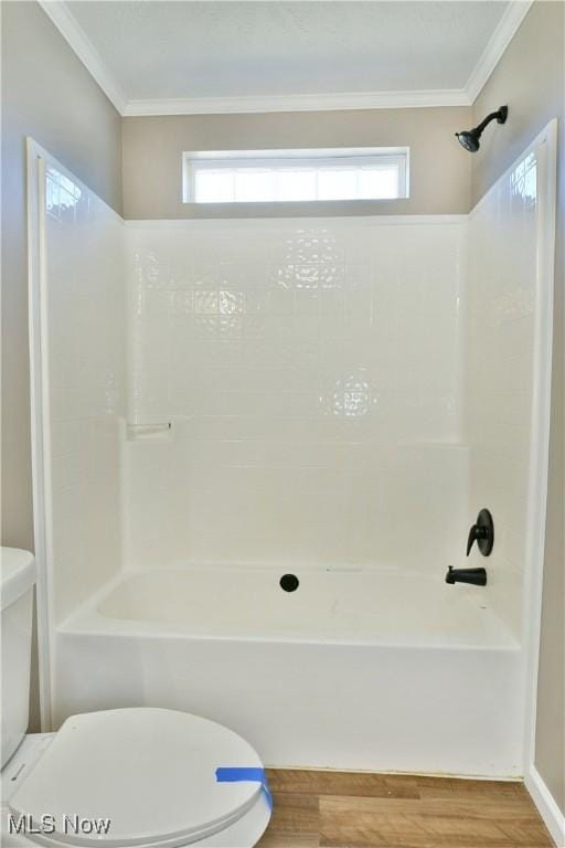 full bathroom featuring a wealth of natural light, toilet, and crown molding