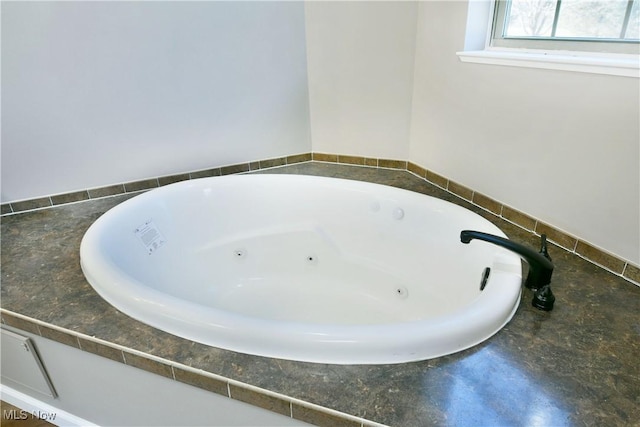 full bath featuring a jetted tub