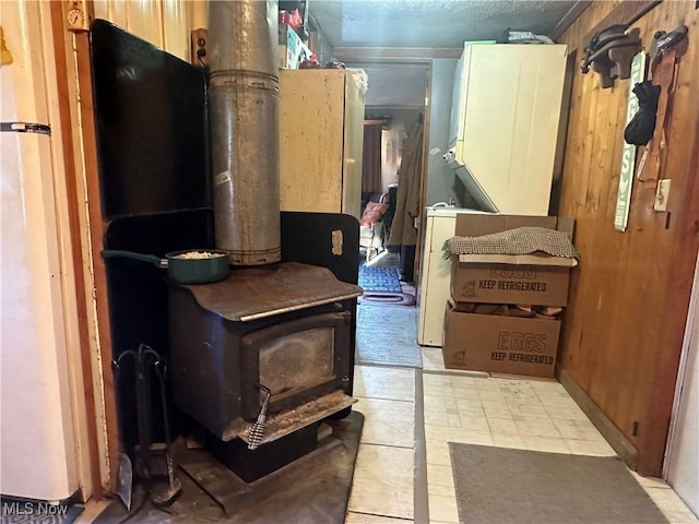 interior space with stacked washer and clothes dryer