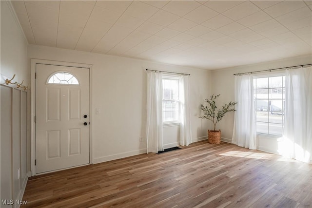 entrance foyer with wood finished floors and baseboards