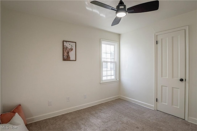 unfurnished bedroom with baseboards, carpet, and ceiling fan