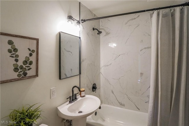 full bath featuring a sink and shower / bath combo