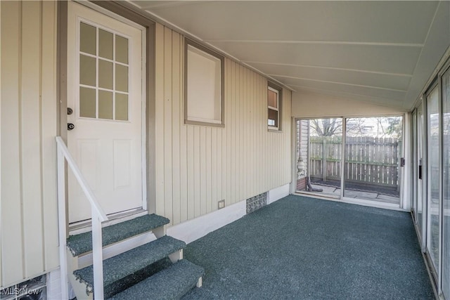 sunroom featuring lofted ceiling