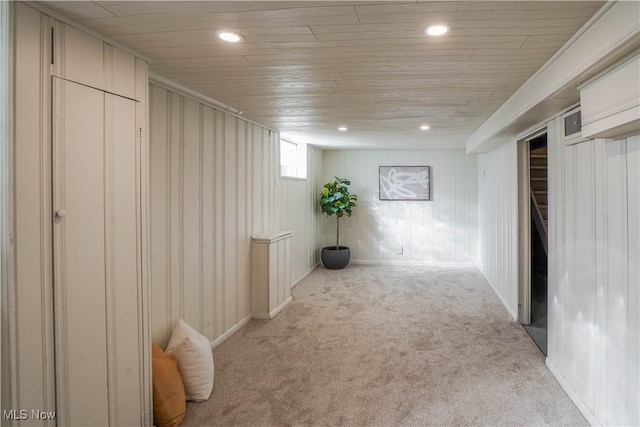 basement with recessed lighting and light colored carpet