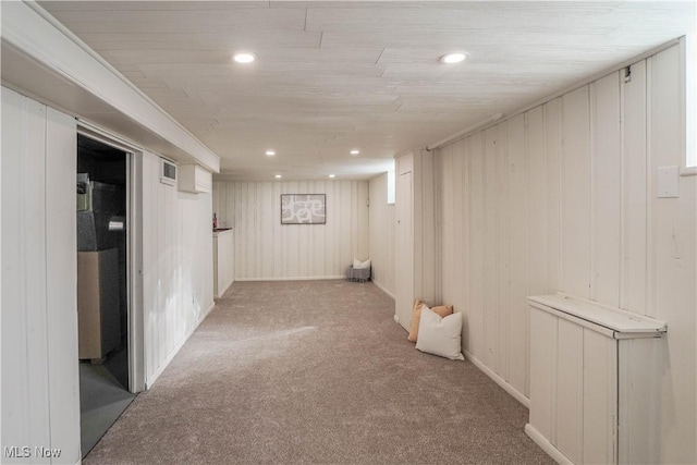 finished basement with recessed lighting, visible vents, and carpet floors