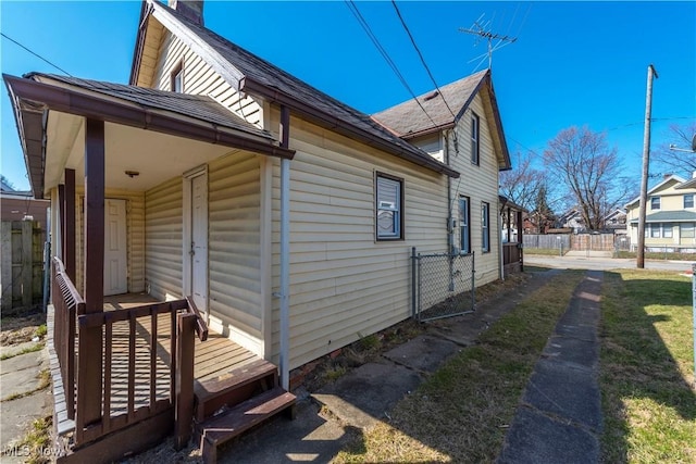 view of side of property featuring fence