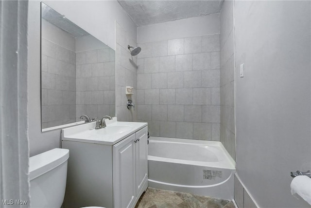 bathroom featuring shower / bathtub combination, toilet, vanity, and a textured ceiling