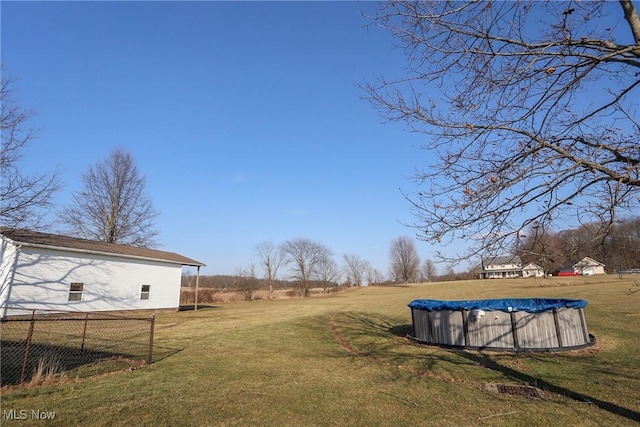 view of yard featuring a covered pool