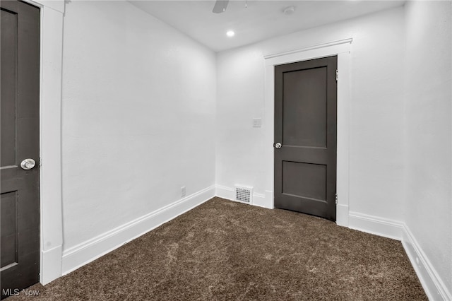 spare room with recessed lighting, carpet flooring, baseboards, and visible vents