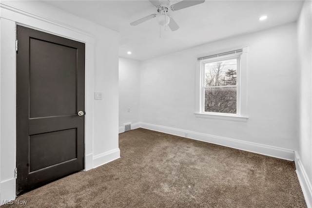 carpeted empty room featuring recessed lighting, baseboards, visible vents, and ceiling fan