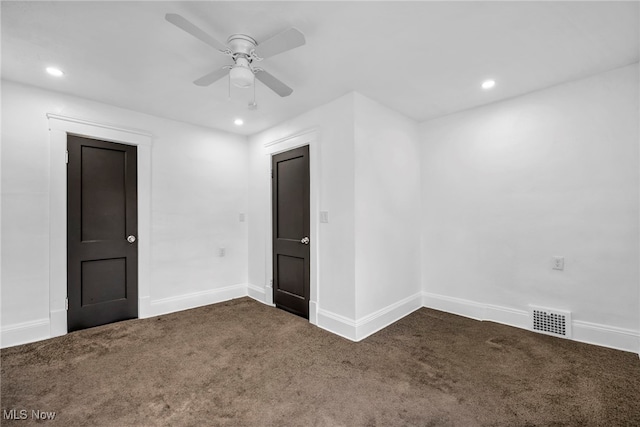 carpeted empty room featuring recessed lighting, visible vents, baseboards, and a ceiling fan