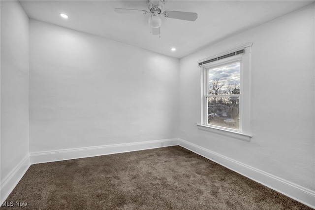 empty room with dark colored carpet, baseboards, recessed lighting, and a ceiling fan