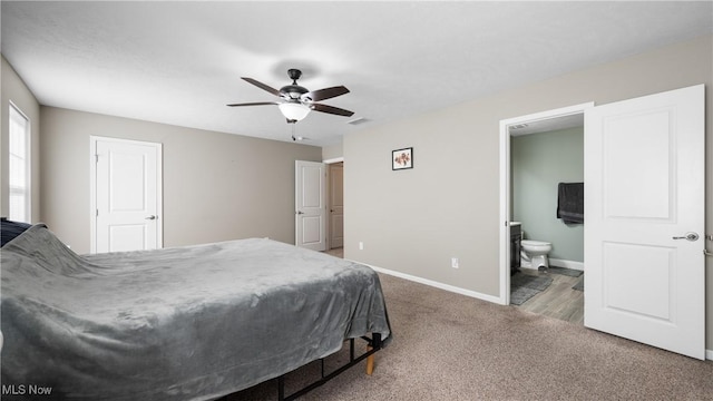 bedroom featuring visible vents, connected bathroom, ceiling fan, baseboards, and carpet floors