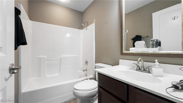 full bath featuring toilet, vanity, and bathing tub / shower combination