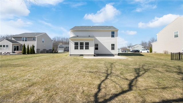 rear view of property with a patio area and a lawn