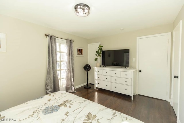 bedroom featuring dark wood-style floors