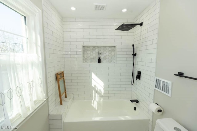 full bathroom featuring recessed lighting, visible vents, toilet, and shower / tub combination