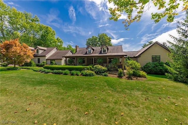 new england style home with a front yard