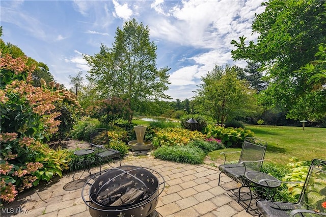 view of patio featuring an outdoor fire pit