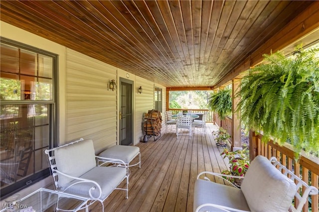 wooden deck with outdoor dining space