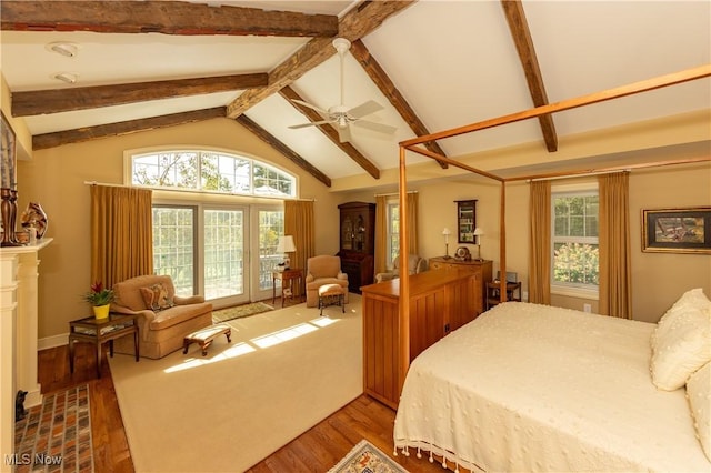 bedroom with beamed ceiling, high vaulted ceiling, wood finished floors, and access to outside