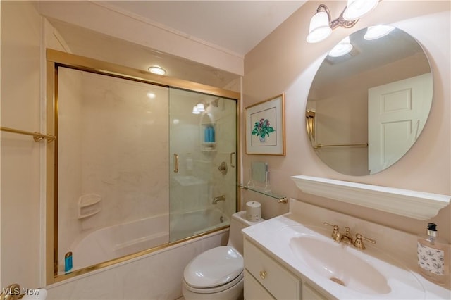 bathroom featuring enclosed tub / shower combo, toilet, and vanity