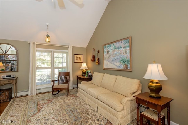 living room featuring baseboards, lofted ceiling, and ceiling fan