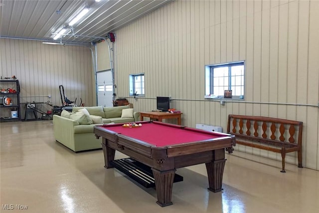 rec room with pool table, a garage, and concrete floors