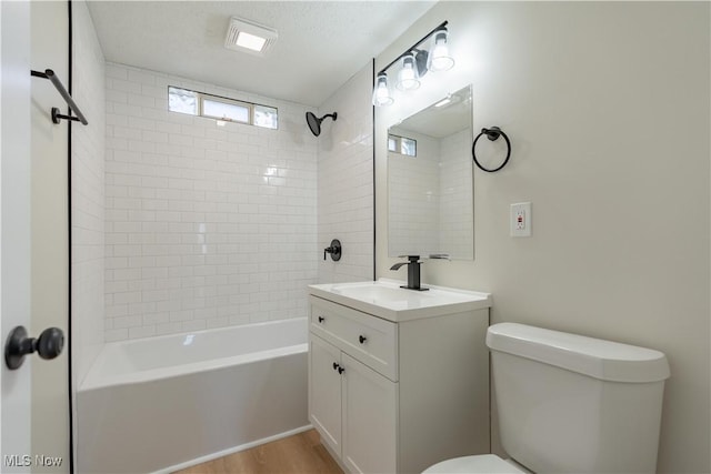 full bath with shower / bathtub combination, toilet, vanity, and wood finished floors