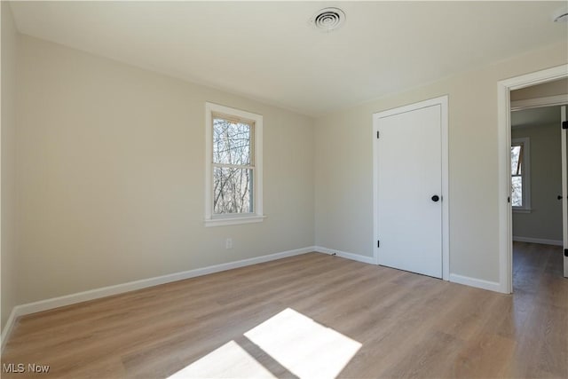 interior space featuring visible vents, baseboards, and light wood-style flooring