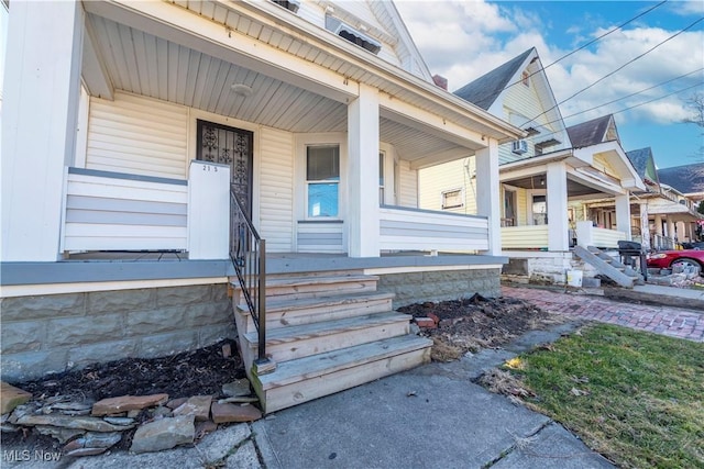 doorway to property featuring a porch