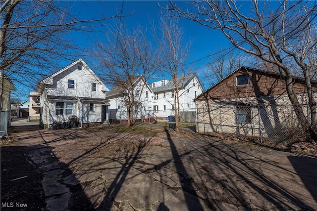 back of property with fence