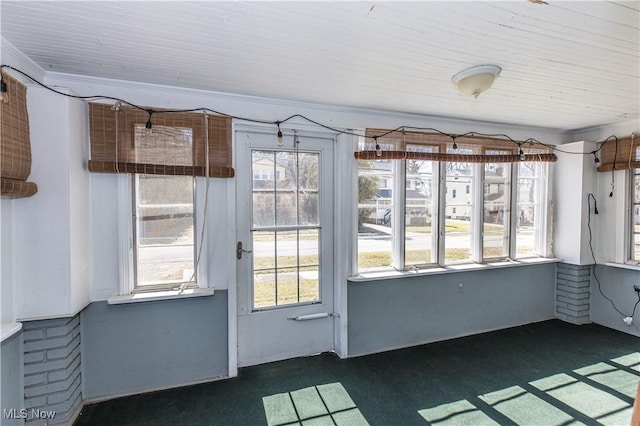 unfurnished sunroom featuring plenty of natural light