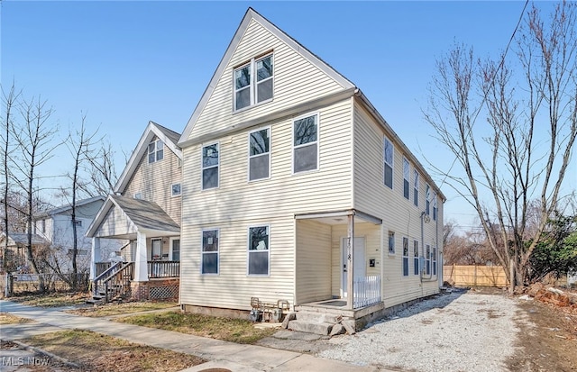 view of front of house featuring fence