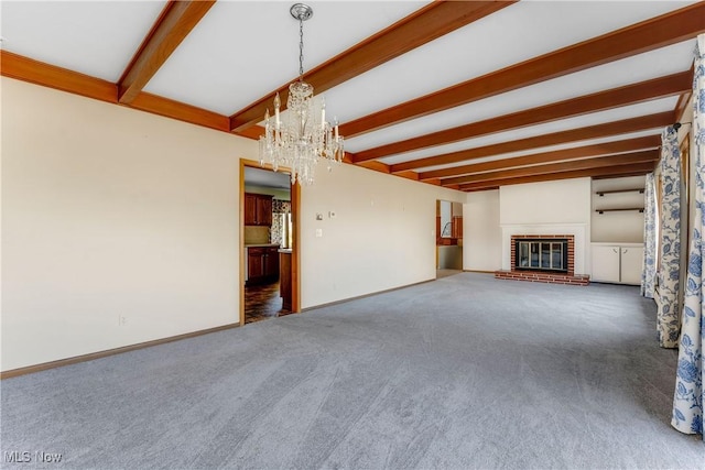 unfurnished living room featuring beam ceiling, carpet, baseboards, and a chandelier